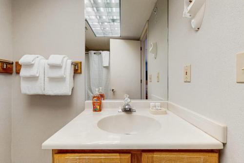 a bathroom with a sink and a mirror at Mountainside Resort F302 in Stowe