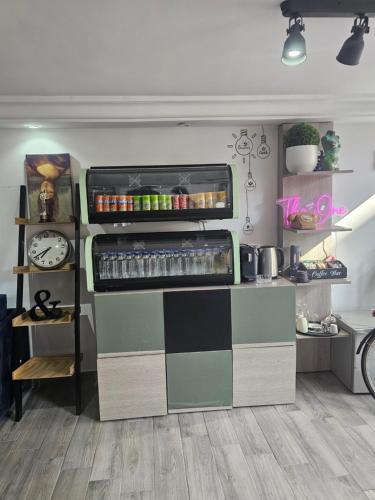 a kitchen with a checkerboard counter in a room at one hostel in Tabarka