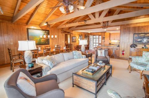a living room with a couch and a table at Out On A Limb in Blowing Rock