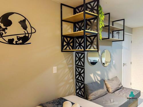 a living room with a shelf and a couch at Fortaleza Sul Prime By Holiday Stays in Fortaleza