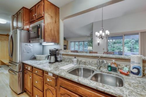 a kitchen with a sink and a refrigerator at Paradise in Vermont in Warren