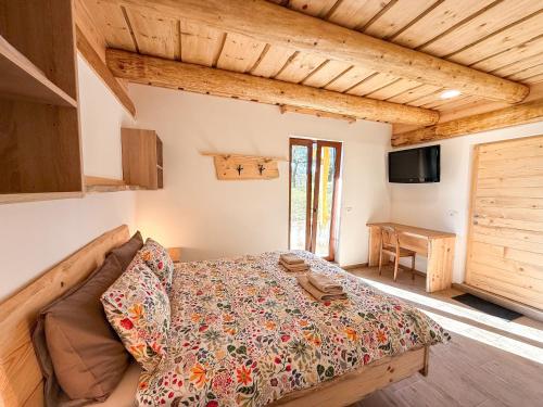 a bedroom with a bed and a couch in a room at Village Vista in Rob