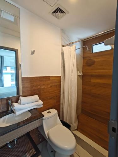 a bathroom with a toilet and a sink and a shower at Purísima 5 0 in Monterrey