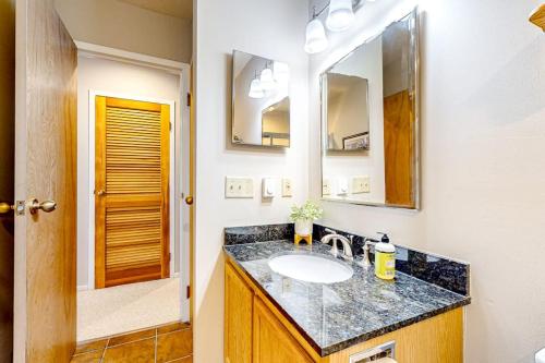 a bathroom with a sink and a mirror at Snow Creek 43 in Warren