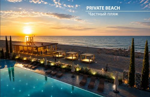 a view of a beach with a pool and the ocean at Miramare Magnetic Beach Hotel in Kobuleti