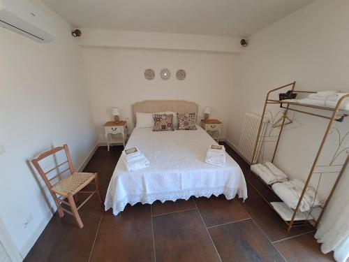 a bedroom with a bed and two shelves at Gredò Home & SPA in Gratteri