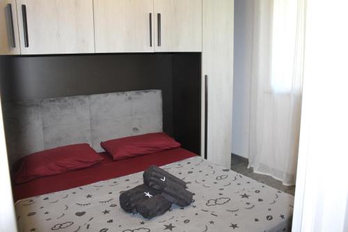 a bedroom with a bed with a suitcase on it at Loft vista mare in Silvi Marina