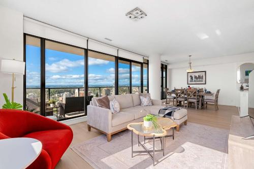 a living room with a couch and a table at Nuage 2 Bed 2 Bath 2 Balconies Parking in Calgary