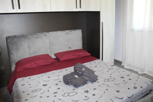 a bed with a bag sitting on top of it at Loft vista mare in Silvi Marina