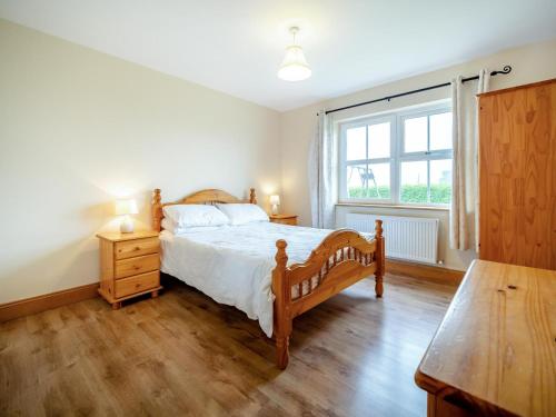 a bedroom with a bed and a large window at 4 Bed in Schull oc-ii09887 in Schull