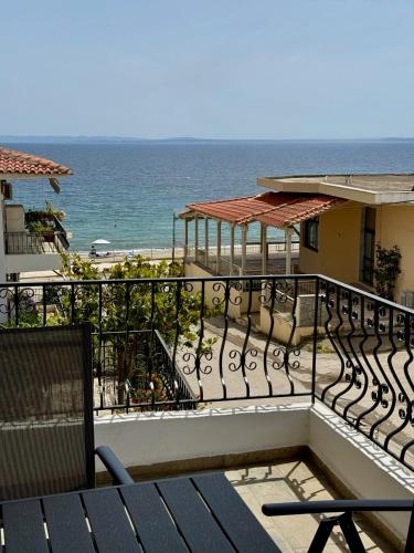a balcony with a view of the ocean at VillaKaliba BEACHFRONT HOUSE in Kalives Poligirou
