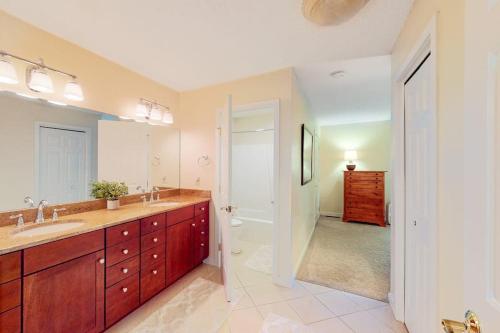 a large bathroom with two sinks and a shower at Malletts Bay Getaway in Colchester