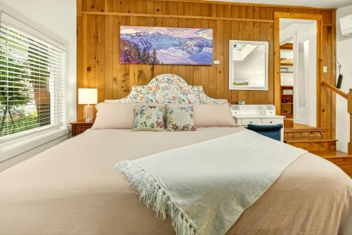 a bedroom with a large bed in a room at Whimsy on B- 2BR & Studio Near OSF in Ashland
