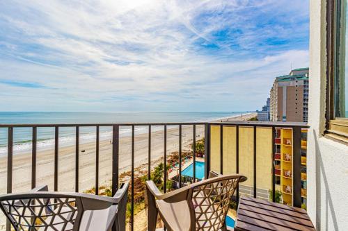 a balcony with chairs and a view of the beach at The Palace 505 in Myrtle Beach
