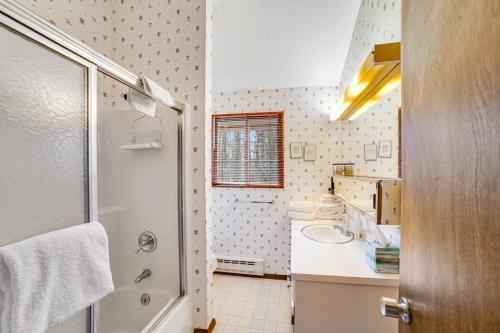a bathroom with a sink and a shower at Dwight Road Getaway in Quechee