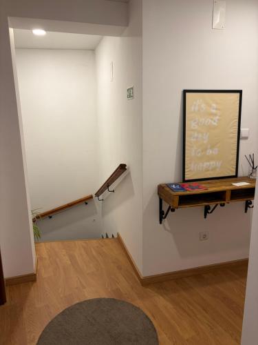 a room with a chalkboard on a wall with a shelf at Kasa102 in Gouveia