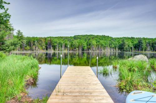a wooden dock in the middle of a lake at Paddle & Pine in Bleecker