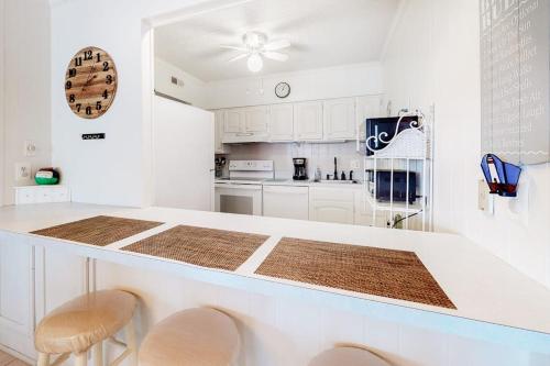 a kitchen with white cabinets and a counter top at Camelot 203B in Ocean City