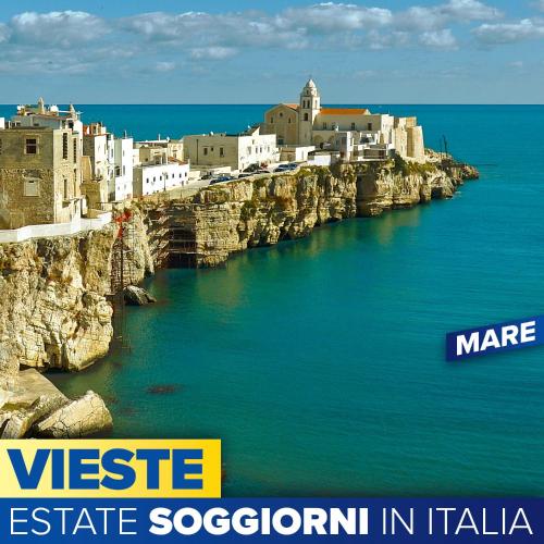 a group of buildings on top of a rocky cliff at Appartamento Centrale Apeneste in Vieste