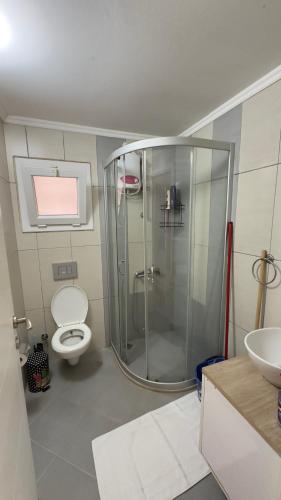 a bathroom with a shower and a toilet and a sink at Kasdreamhill in Kaş