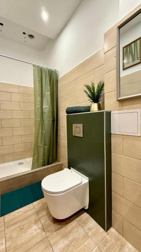 a bathroom with a toilet and a sink and a shower at Beautiful Rooms - Park Kasprowicza in Szczecin