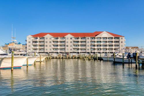 a large building with a marina and boats in the water at White Marlin 209B in Ocean City