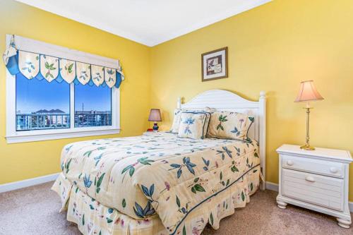 a bedroom with a bed and a window at Lorelei I 404 in Ocean City