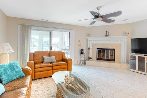 a living room with a couch and a fireplace at Sunset Harbour B in Ocean City