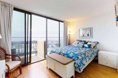 a bedroom with a bed and a large window at Century I 2521 in Ocean City