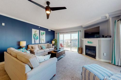 a living room with a couch and a fireplace at Bahia Vista II 305 in Ocean City