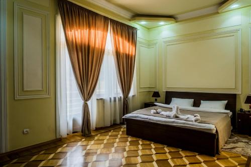 Кровать или кровати в номере S&L Boutique Hotel