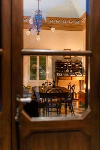 a dining room table and chairs in a kitchen at Tenuta Colavecchio Wine Relais in Putignano