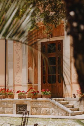 a door of a building with potted plants on it at Tenuta Colavecchio Wine Relais in Putignano