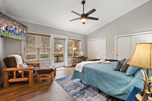 a bedroom with a bed and a ceiling fan at License to Chill Boone in Banner Elk
