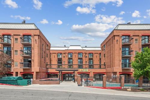 a large red brick building on a street at Classic Ski-in Ski-out Condo in Park City