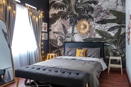 a bedroom with a large bed with a floral wallpaper at Kalysandria Home in Padasul