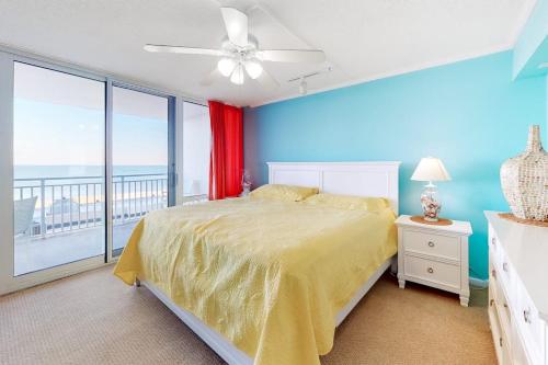 a bedroom with a bed and a large window at Carousel 706 in Ocean City