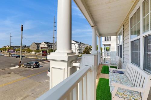 a white porch with a bench on a house at 16 The Palms in Ocean City