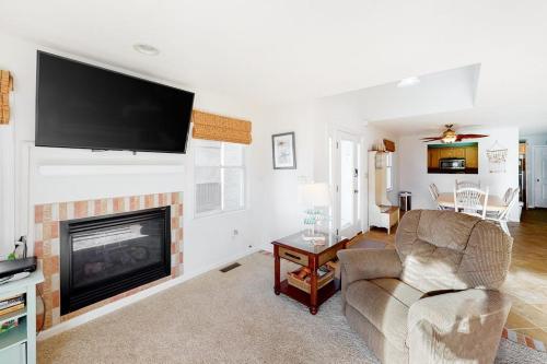 a living room with a couch and a fireplace at 604 Seaweed Lane #1 in Ocean City
