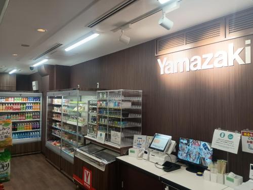 a yamazuki store with a cash register in a store at Hotel Sunroute Tochigi in Tochigi