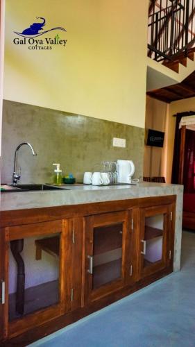 a kitchen with a sink and a counter top at Gal Oya Valley Cottages in Ampara