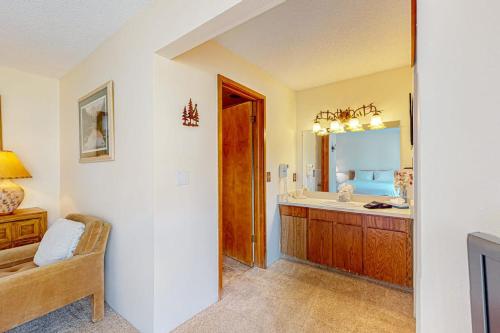 a bathroom with a sink and a mirror at Pine Ridge Condos in Breckenridge