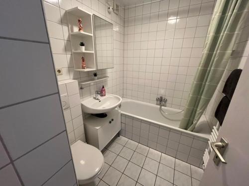 a small bathroom with a toilet and a sink at Süße Marie 18 - Coffee for free - in Karlsruhe