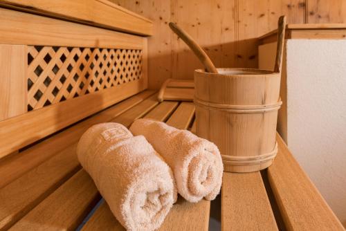 a pair of towels sitting in a sauna at Apparthotel Bliem in Schladming