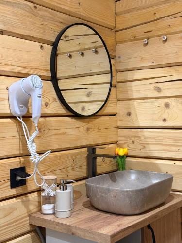 a bathroom with a sink and a mirror at Nice House in Maidan Village