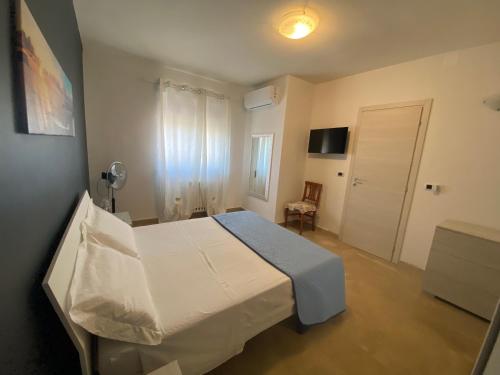 a hospital room with a bed and a chair at Near Sea in Monopoli