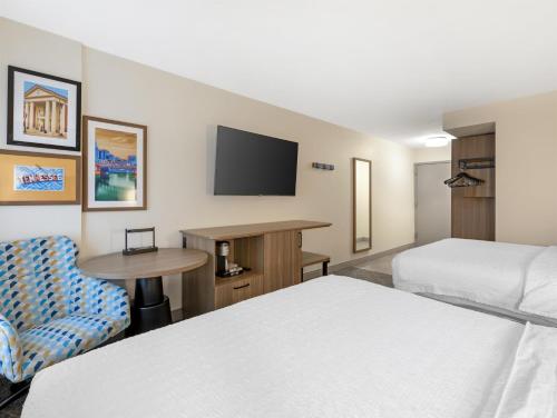 a hotel room with two beds and a tv at Hampton Inn & Suites Nashville Franklin in Franklin