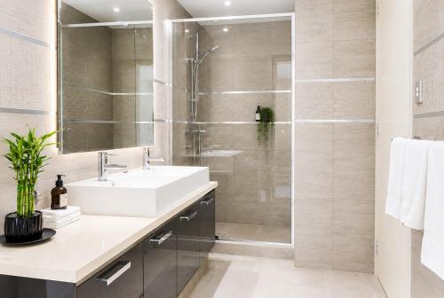 a bathroom with a sink and a shower at Rooftops on HenryCentre of West End Cafes in Fremantle
