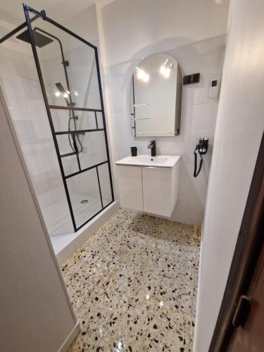 a bathroom with a sink and a mirror at A casa di catharina appartement in Zicavo