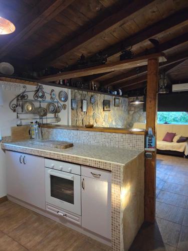 a kitchen with a sink and a counter top at Charming Stone House Dobrinj in Dobrinj
